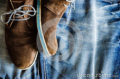 Detail of vintage leather shoes on denim fabric Stock Photo