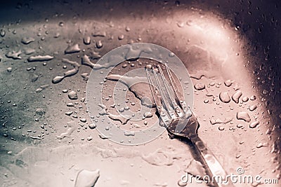 Detail of wet fork and drops Stock Photo