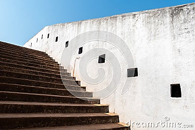 Detail of the white walls and steps leading up to the ancient watch tower Stock Photo