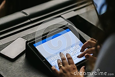 Detail of a woman`s hands using a mobile phone or tablet Stock Photo