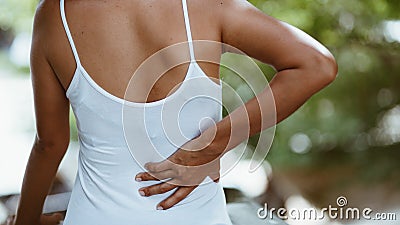 Detail of woman suffering backache Stock Photo