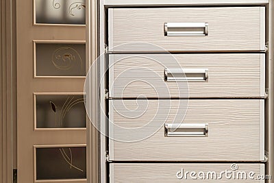 Detail of wooden furniture cabinet chest with drawers front Stock Photo