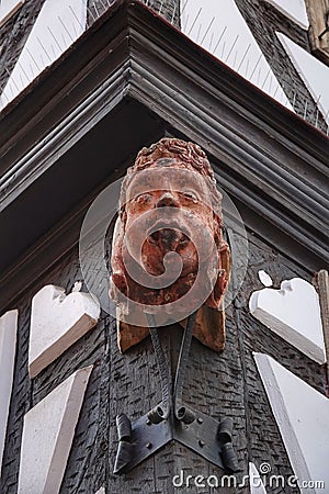 Detailed architectural carving of a human face on the corner of a building in Neustadt. Editorial Stock Photo