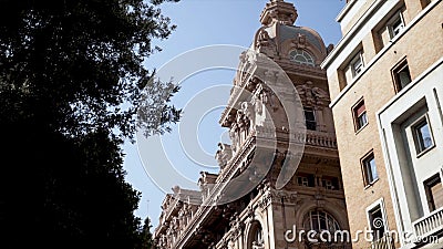 Detailed architectural old building in European city. Action. Beautiful old building made of red stone with many Stock Photo