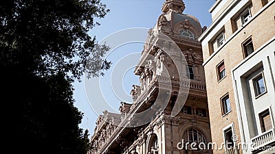 Detailed architectural old building in European city. Action. Beautiful old building made of red stone with many Stock Photo