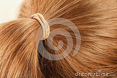 Detailed closeup of brown hair in ponytail Stock Photo