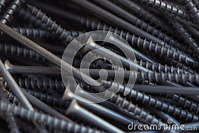 Detailed dark background and texture full frame of pile metal steel nails for construction of carpenter Stock Photo