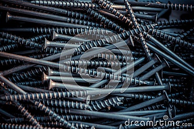 Detailed dark background and texture full frame of pile metal steel nails for construction of carpenter Stock Photo