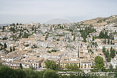 Detailed landscape photo of Albacin district, Granada old town, Andalusia, Spain 2019. White houses with tiled roofs surrounded by Stock Photo