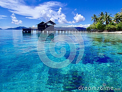 View from the pier to the beach on the island of Arborek. Raja Ampat best place on earth. Paradise holiday. Stock Photo