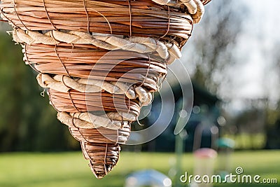 Detailed, shallow focus of a hand-made woven hanging basket. Stock Photo