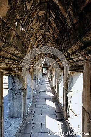 Detailed shot of an ancient corridor adorned with a stone vaulted ceiling Stock Photo