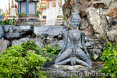 Detailed statue and architecture in Wat Pho, Buddhist temple, Bangkok, Thailand. Stock Photo