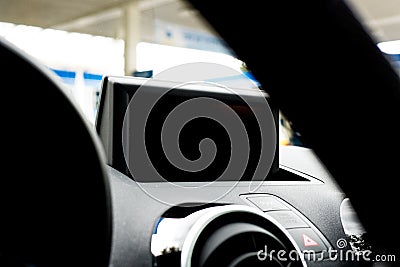Detailed view of a car display and a steering wheel in the blurred front Stock Photo