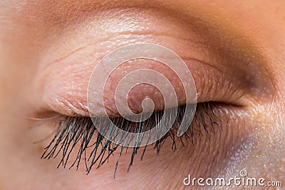 Detailed view of closed eye of woman Stock Photo