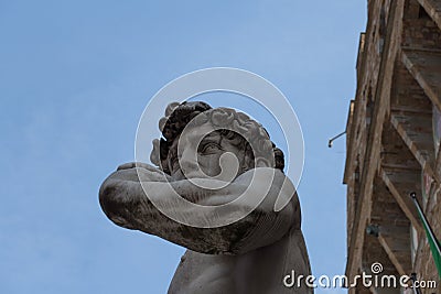 Detailed view of the copy of statue David by Michelangelo in front of the Palazzo Vecchio, Florence, Italy Editorial Stock Photo