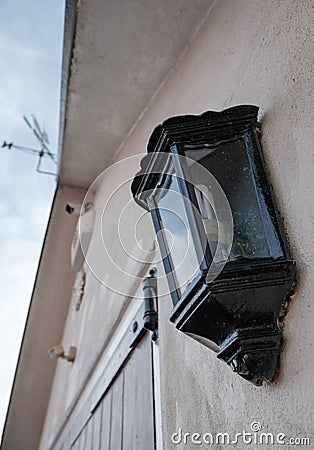 Detailed view of detached garage showing a PIR lighting system and CCTV camera. Stock Photo
