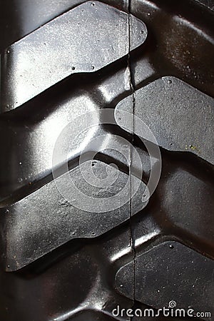 Detailed view of heavy vehicle rubber tire tread texture of a new tractor Stock Photo