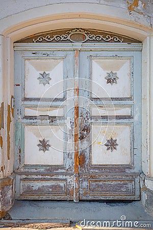 Detailed view of a richly shaped wooden door Stock Photo