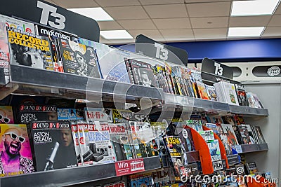 Detailed view of a well-stocked magazine rack seen within a well know high street store. Editorial Stock Photo