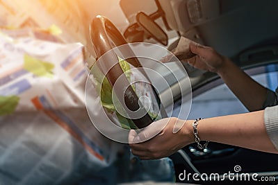 Detailing service, preparing leather steering wheel for painting, female worker hands wipes steering wheel with fine Stock Photo