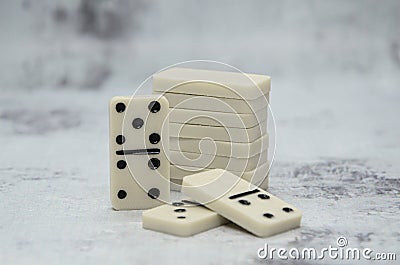 Details of board game dominoes on abstract gray background Stock Photo