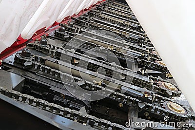 Reaper. Harvesting machine. Chain grips. Stock Photo