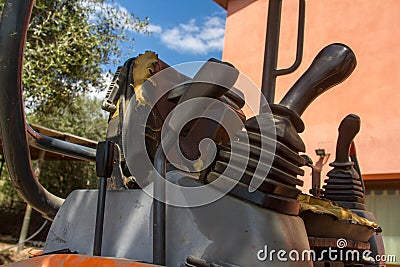 Details of crawler excavator such as the controls the cloches the bucket the hydraulic pumps the tracks Stock Photo