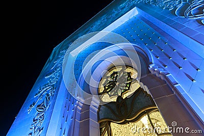 Details of the external facade of The Sheikh Zayed Grand Mosque illuminated with blue light in the evening Editorial Stock Photo