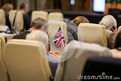 Details with the flag of the United Kingdom during a conference of European Union officials Editorial Stock Photo