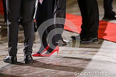 Details with the high heels shoes and feet of a young lady Stock Photo