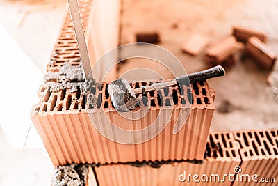 house building, brick walls and steel infrastructure. Construction site with interior walls Stock Photo