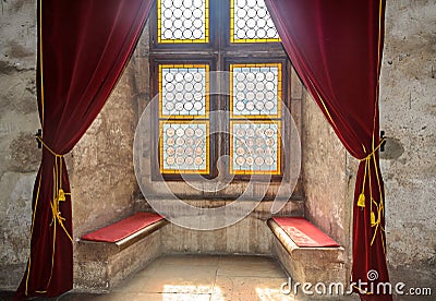 Details from the interior room of the Corvins Castle build by John Hunyadi, colored window. Editorial Stock Photo