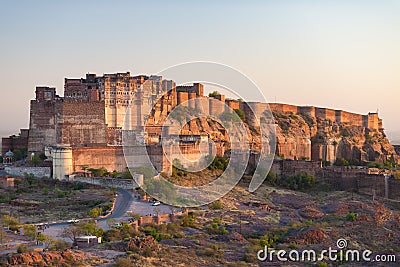 Details of Jodhpur fort at sunset. The majestic fort perched on top dominating the blue town. Scenic travel destination and famous Stock Photo