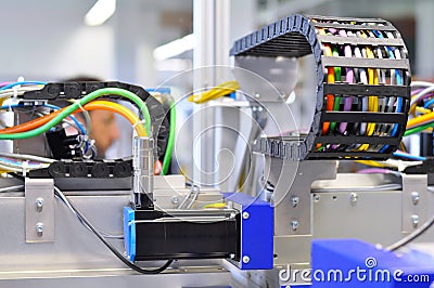 details of a machine with pneumatic lines in industrial production for electronic components Stock Photo