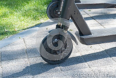Details mechanism of used electric scooter close up. Stock Photo