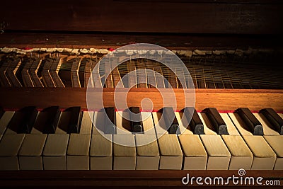 Details of an old baroque clavichord strings keyboard Stock Photo