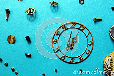 Details of old watches are scattered on the table Stock Photo