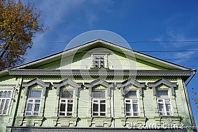 Details of the old wooden house with traditional carved window frames in the historical center of Tver city Editorial Stock Photo