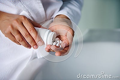 Details: pills in woman hands. Patient taking medicine. Compliance to doctor& x27;s prescription. Healthy lifestyle Stock Photo