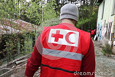Details with the Red Cross and Red Crescent symbol on a uniform. Editorial Stock Photo