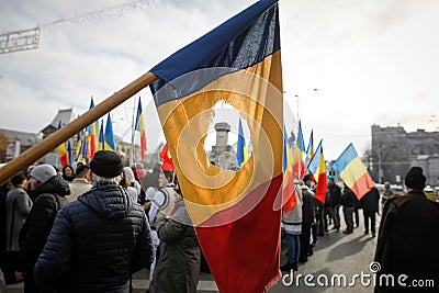 Details with the Romanian flag with a hole, the symbol of the Romanian Revolution from December 1989 when the communist emblem was Editorial Stock Photo