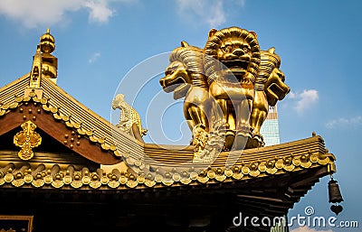 Details of roof golden Lions on Buddhist Jing An Tranquility Temple - Shanghai, China Stock Photo