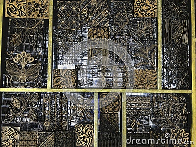 Details, structure and ornaments of forged iron gate. Floral decorative ornament, made from metal. Vintage metallic pattern. Stock Photo