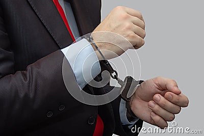 And detained suspected persons in handcuffs, a business man in the police Stock Photo