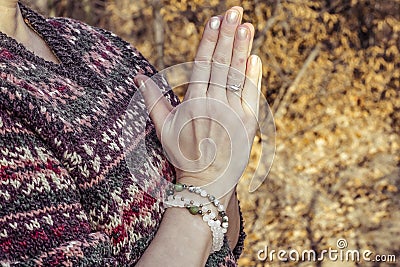 Detal of woman doing namaste hand mudra pose Stock Photo