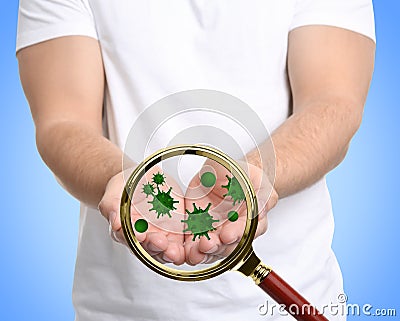 Detecting bacteria with magnifying glass on background, closeup. Prevention disease Stock Photo