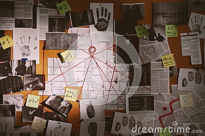 Detective board with fingerprints, photos, map and clues connected by red string Stock Photo