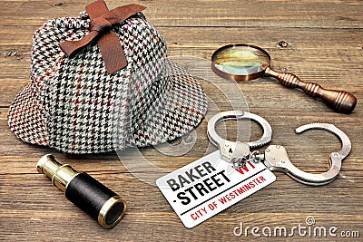 Detective Hat, Spyglass and Magnifier, sign Baker Street and han Editorial Stock Photo