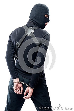 Detention of a dangerous terrorist in black clothes and a mask Stock Photo